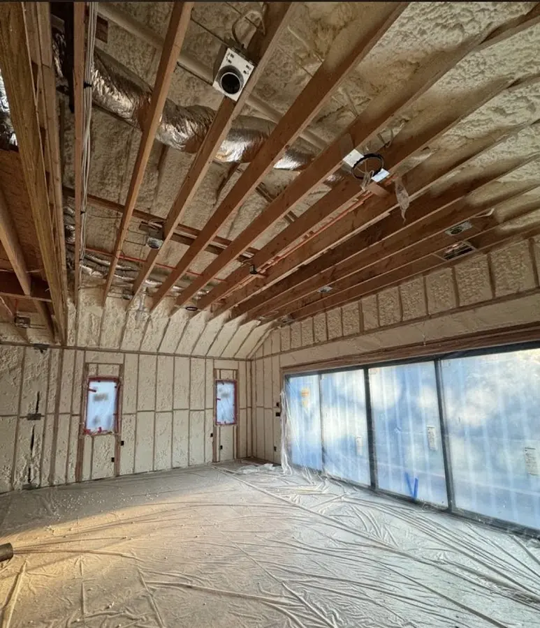 Interior walls and ceiling insulated with spray foam during new construction in Olney